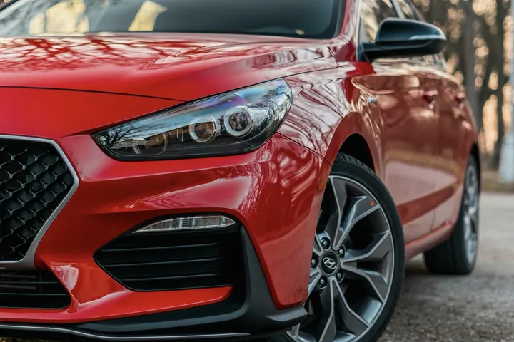 A glossy red hatchback
